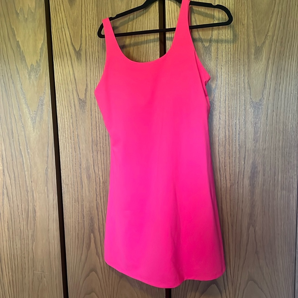 Zyia match point dress has fitted shorts  attached underneath with side pockets